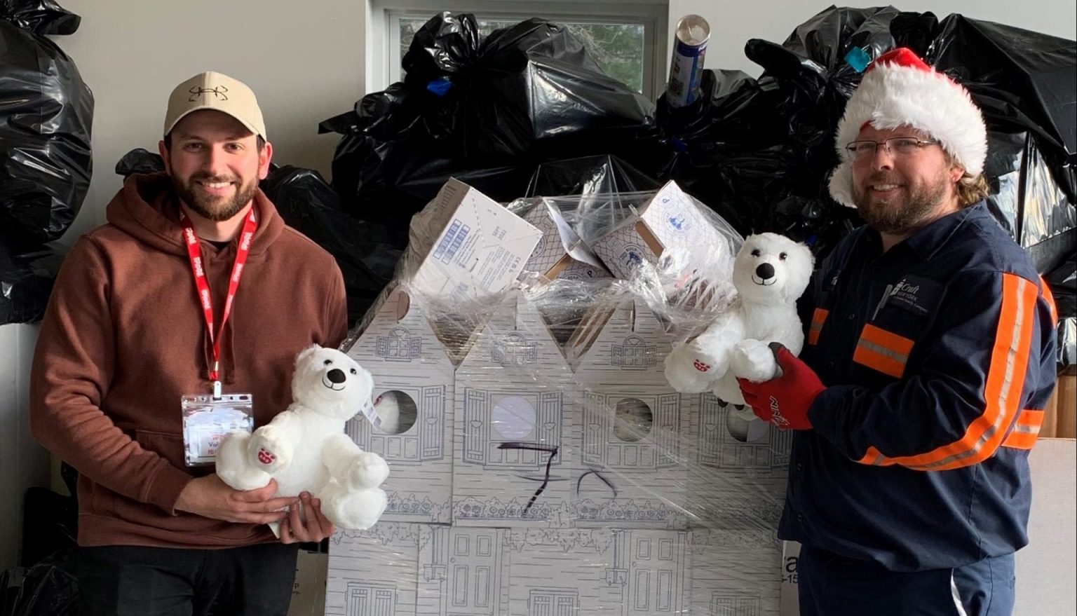 employees holding bears at Toys for Tots fundraiser